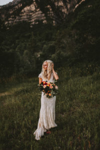 adelaide-lace-bohemian-wedding-dress-shown-with-bouquet