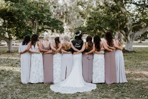 indie-bride-wearing-dreamers-and-lovers-strapless-boho-wedding-dress -with-leather-jacket