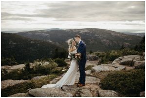 Boho-wedding-at-acadia-national-park-bride-wearing-off-the-shoulder-lace-gown
