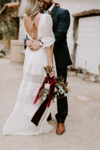 palm-springs-wedding-bride-wearing-long-sleeve-silk-panelled-dress