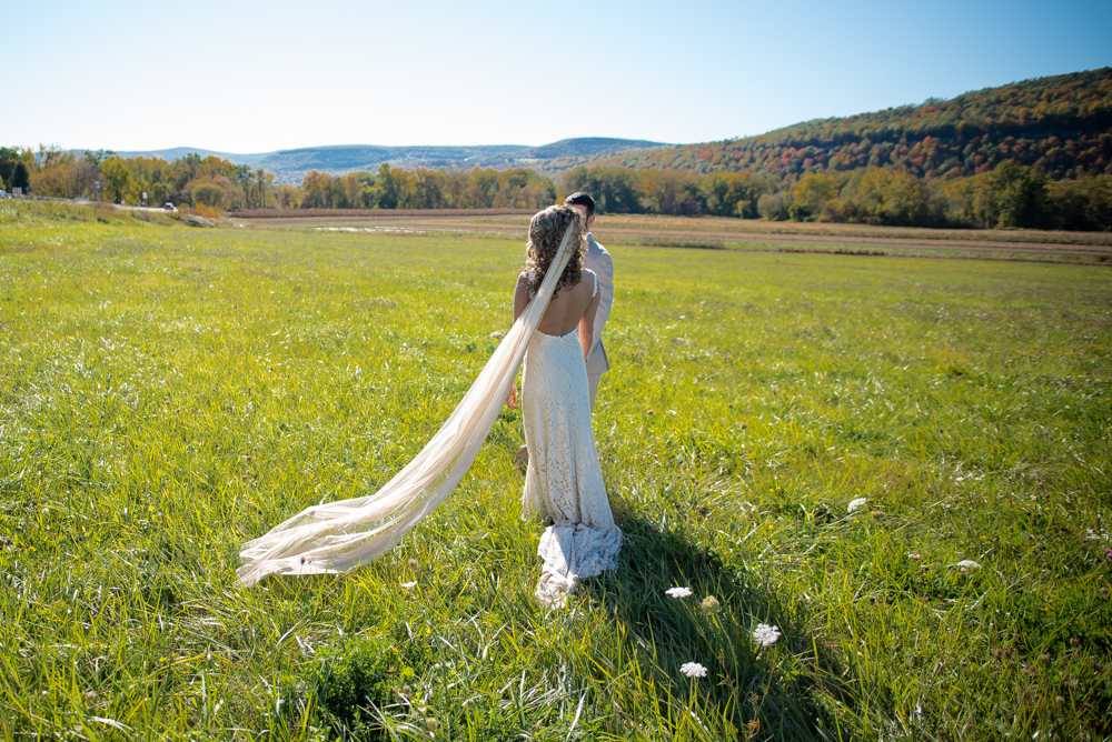 a-boho-bride-in-a-dreamy-field-wearing-a-vintage-style-wedding-dress