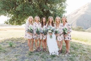 a-boho-wedding-at-a-rustic-farmhouse-in-california-here-with-her-bohemian-bridesmaids-in-floral-dresses