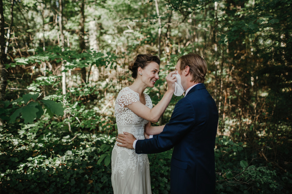 lye-and-drew-at-their-campsite-bohemian-wedding-here-the-bride-wipes-a-tear-from-her-groom
