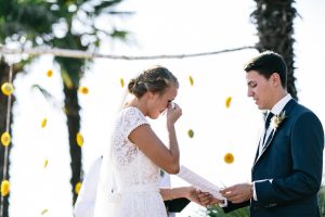 bohemian-wedding-ceremony-groom-reading-his-vows-while-the-bride-is-in-tears