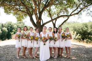bohemian-bride-and-her-boho-bridesmaids-all-wearing-white-with-wildflowers