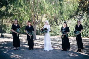 bridesmaids-wearing-mismatched-black-dresses-bohemian-wedding-inspiration