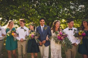 the-happy-bride-groom-and-bridal-party-shares-laughs-in-this-Oklahoma-bohemian-wedding