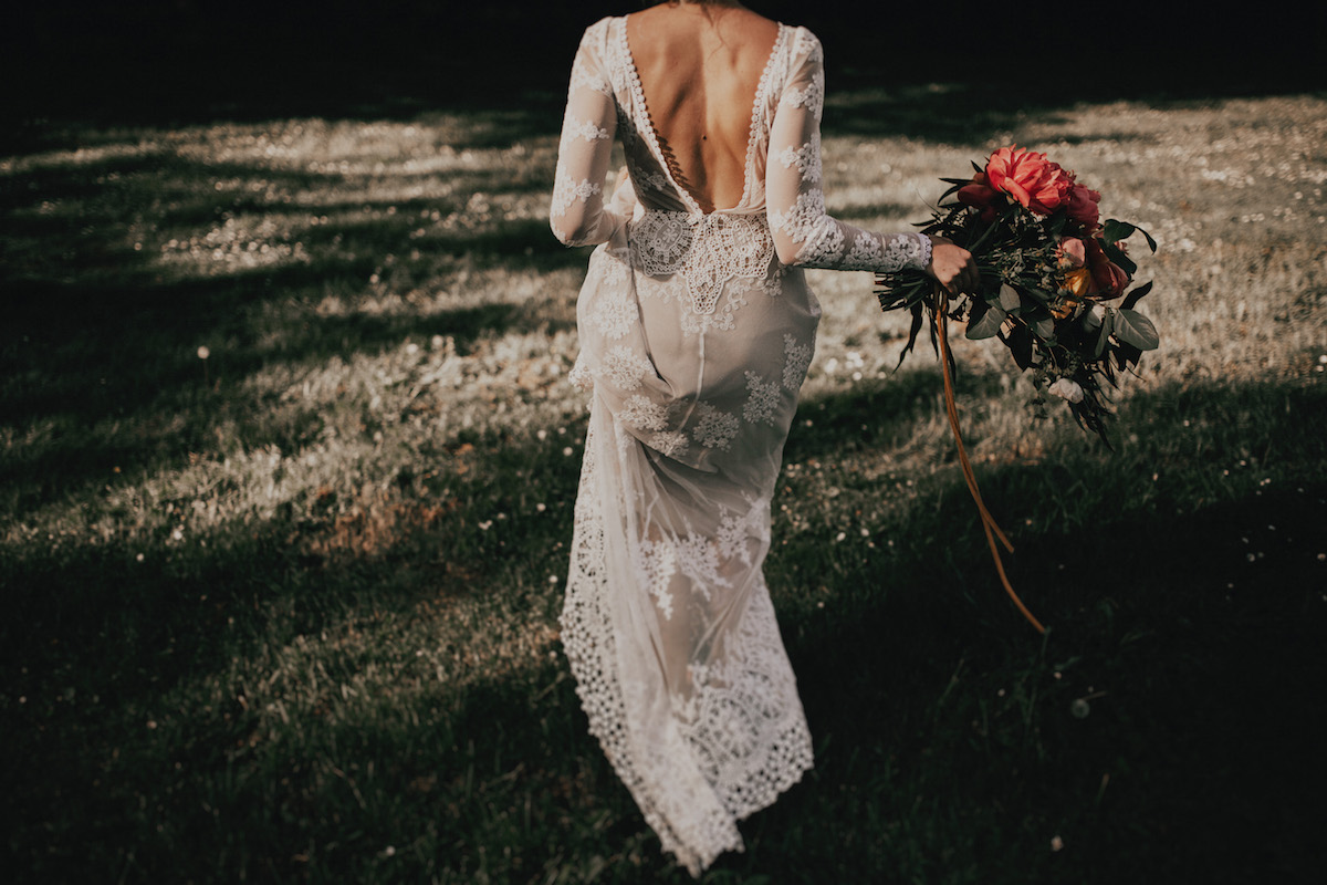 a-boho-wedding-dress-with-backless-and-long-sheer-sleeves-for-the-bohemian-bride