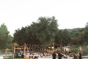 string-llghts-draped-from-trees-at-this-relaxed-vibe-ranch-wedding