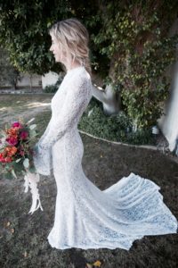 bride-jennie-in-dreamers-and-lovers-long-bell-sleeve-simple-wedding-dress-in-white-lace-with-nude-liner