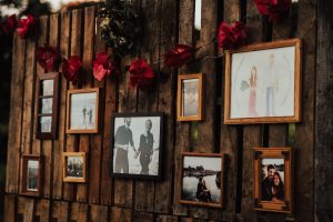 photos-of-the-couple-on-a-rustic-wooden-wall-bohemian-wedding-decor
