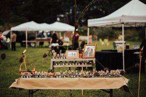 the-dessert-table-adorned-with-photod=of-the-couple-boho-beach-wedding-inspo