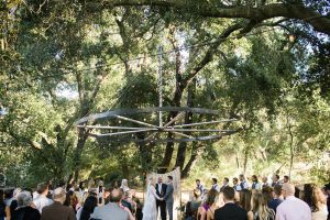 an-intimate-california-wedding-under-the-oak-tree-with-macrame-lace-ceremony-backdrop-and-a-simple-longsleeve-boho-chic-lace-wedding-dress