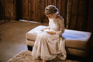 bride-sadie-reading-her-vows-pre-wedding-ceremony-wearing-dreamers-and-lovers-lisa-lace-bohemian-wedding-dress