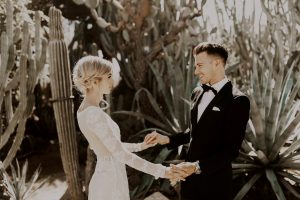 bride-and-groom-in-front-of-cactuses-palm-springs-california