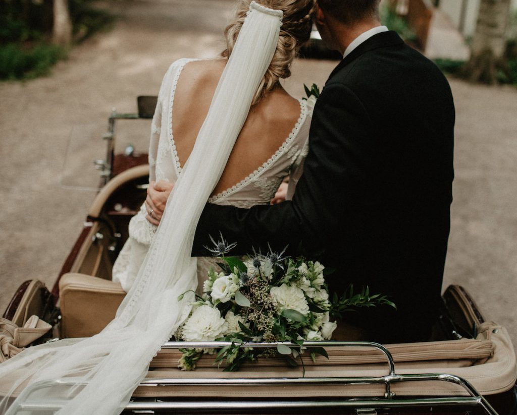 even-the-bride-who-is-antiveil-will-love-this-bride's-veil-with-her-backless-bohemian-lace-wedding-dress