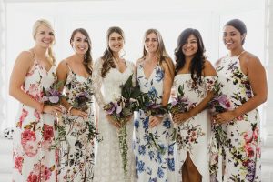 bride-Jen-and-her-bridesmaids-posed-for-photos-wearing-sloral-bohemian-bridesmaid-dresses-in-different-colors