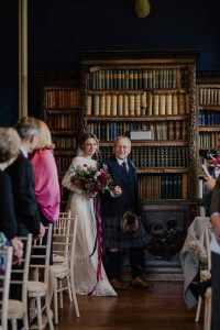 boho-bride-Ruth-escorted-by-her-father-at-her-non-traditional-wedding-in-Scotland's-cambo-estate