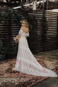 Carrie-lace-wedding-dress-with-plunge-back-low-cut-neckline-long-train-and-flutter-sleeves