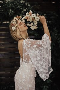 Samantha-angel-sleeves-wedding-dress-in-off-white-lace-with-long-dreamy-train-and-built-in-corset