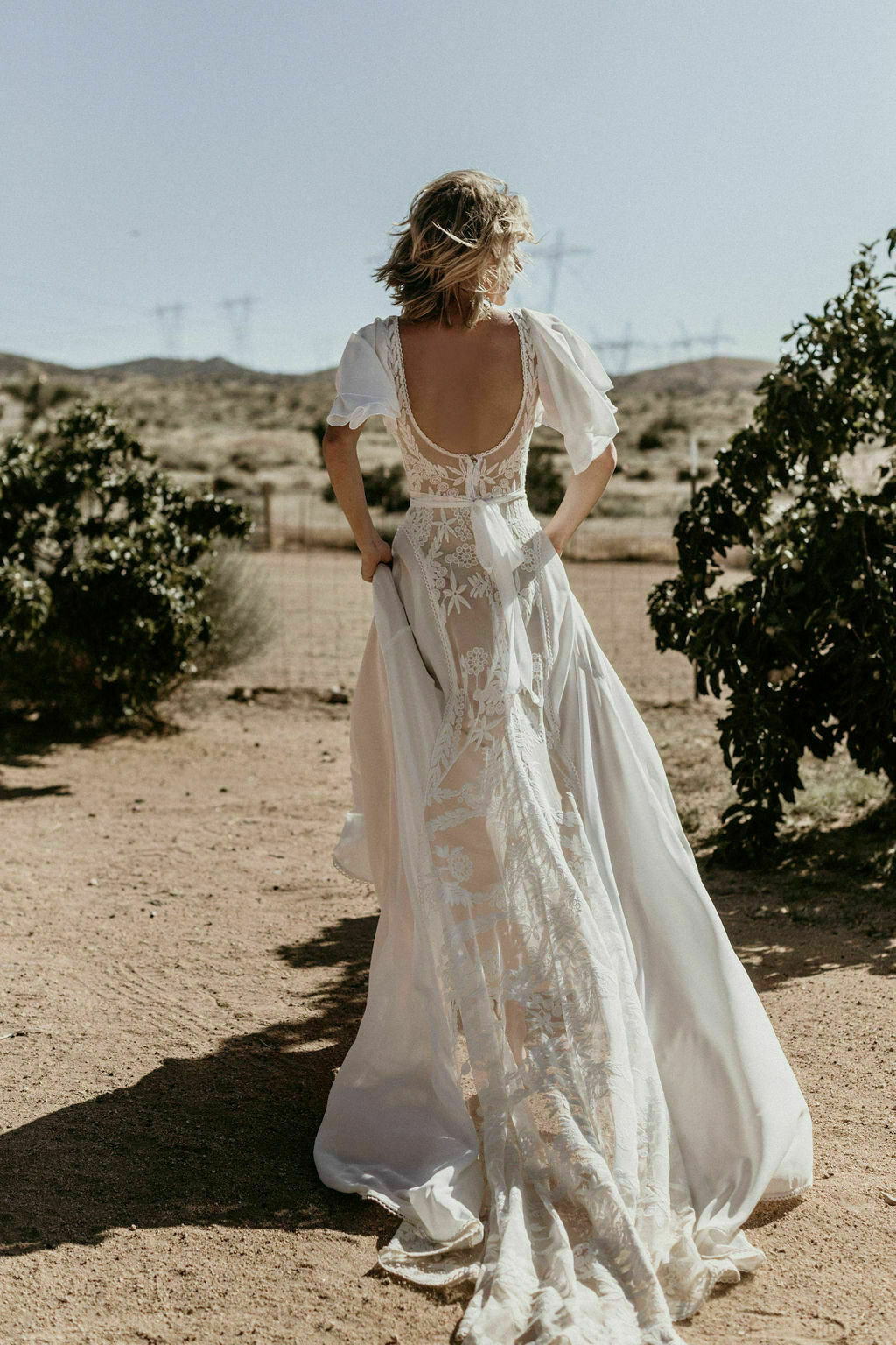 One-of-a-kind-Hayley-lace-and-crepe-romantic-wedding-dress-with-cape-sleeves