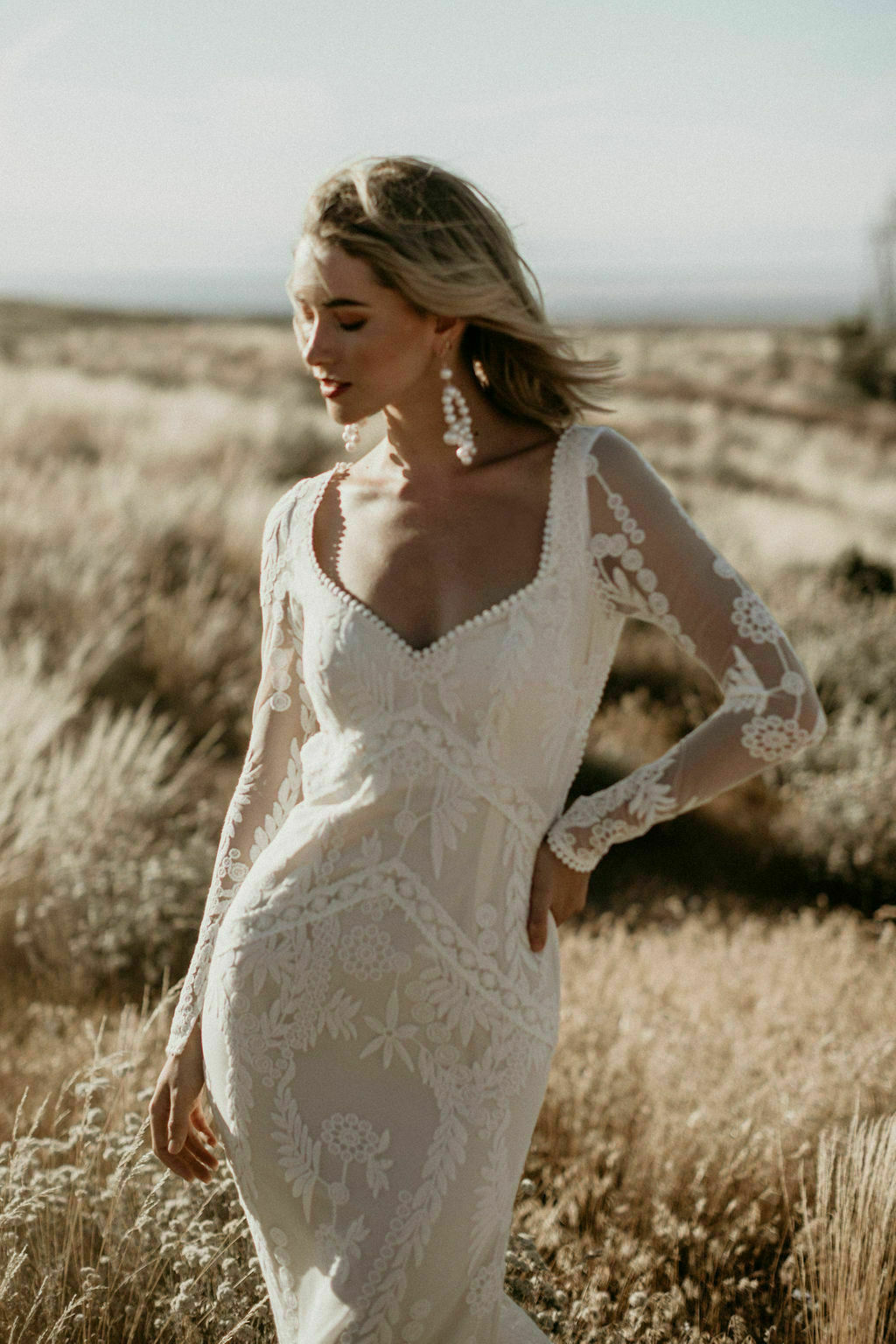 Violetta-unique-lace-wedding-dress-with-open-back-long-sleeves-and-dreamy-train-a-boho-bride's-dream
