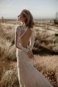 DREAMIEST-Violetta-unique-lace-wedding-dress-with-open-back-long-sleeves-and-fitted-silhouette