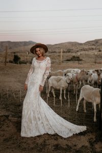 Willow-lace-wedding-dress-with-long-sleeves-cutout-open-back-and-long-train-made-to-your-exact-measurements-in-California