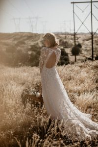 zinnia-romantic-bohemian-wedding-dress-with-long-sleeves-and-open-back-with-the-dreamiest-train