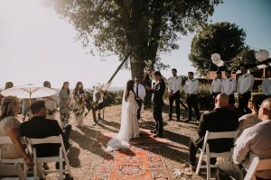 A-Bohemian-Wedding-with-vintage-rug-aisle-at the Condor's Nest Ranch