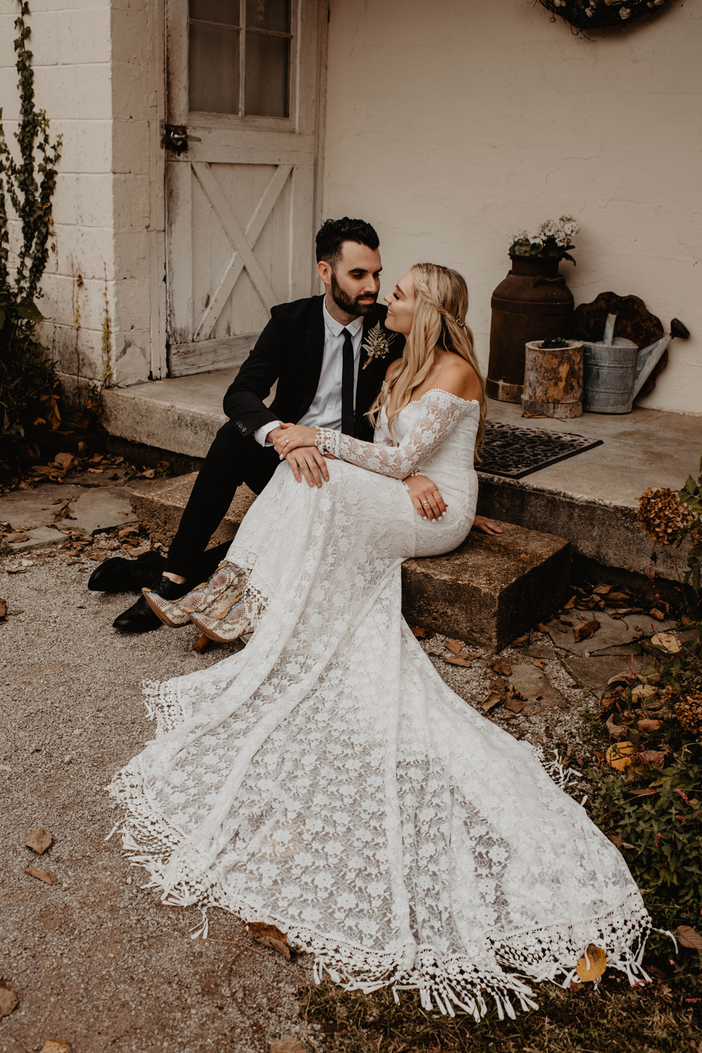 Bride-wearing-meredith-lace-wedding-dress-with-fringe