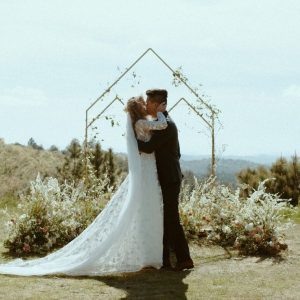 the-romantic-bride-wearing-flowy-lace-wedding-dress