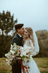 Bride-wearing-zinnia-long-sleeve-wedding-dress
