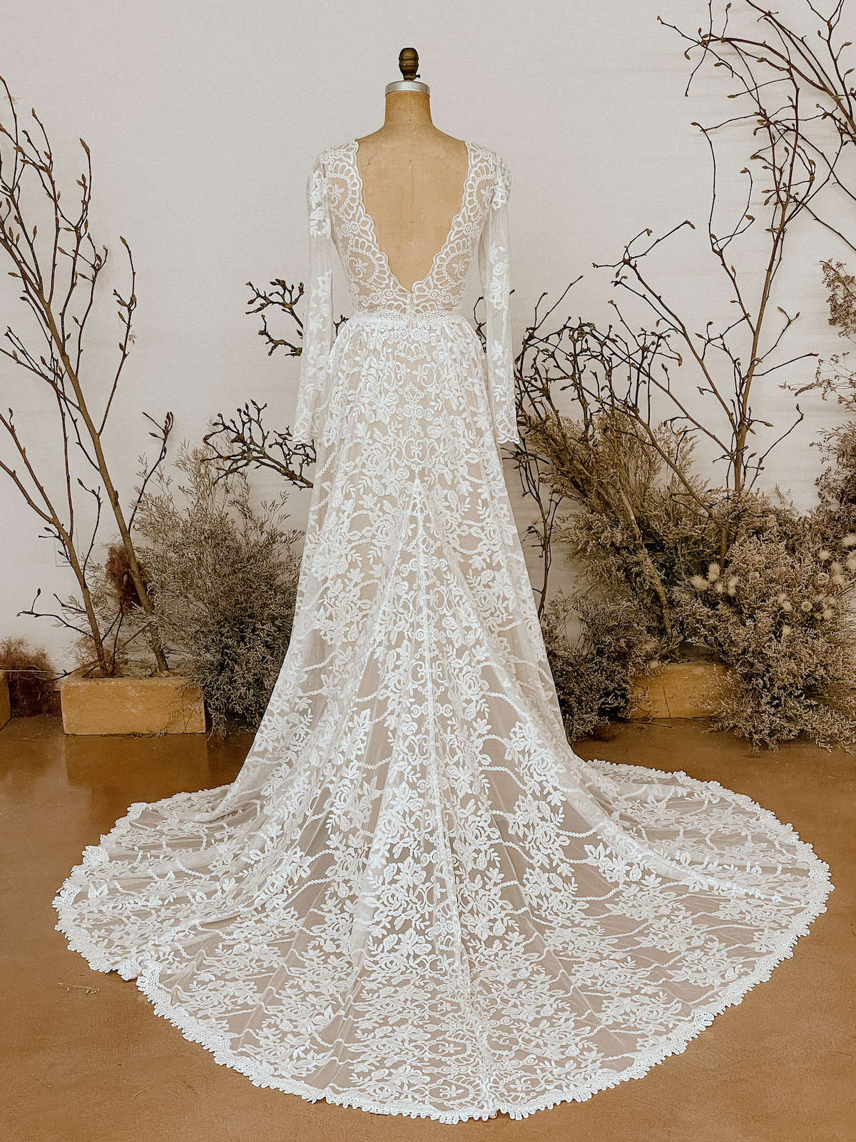 Dahlia-elegant-lace-wedding-dress-shown-with-nude-colored-liner
