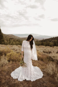 Kate-lace-keyhole-back-wedding-dress-with-high-neckline-and-three-quarter-sleeves