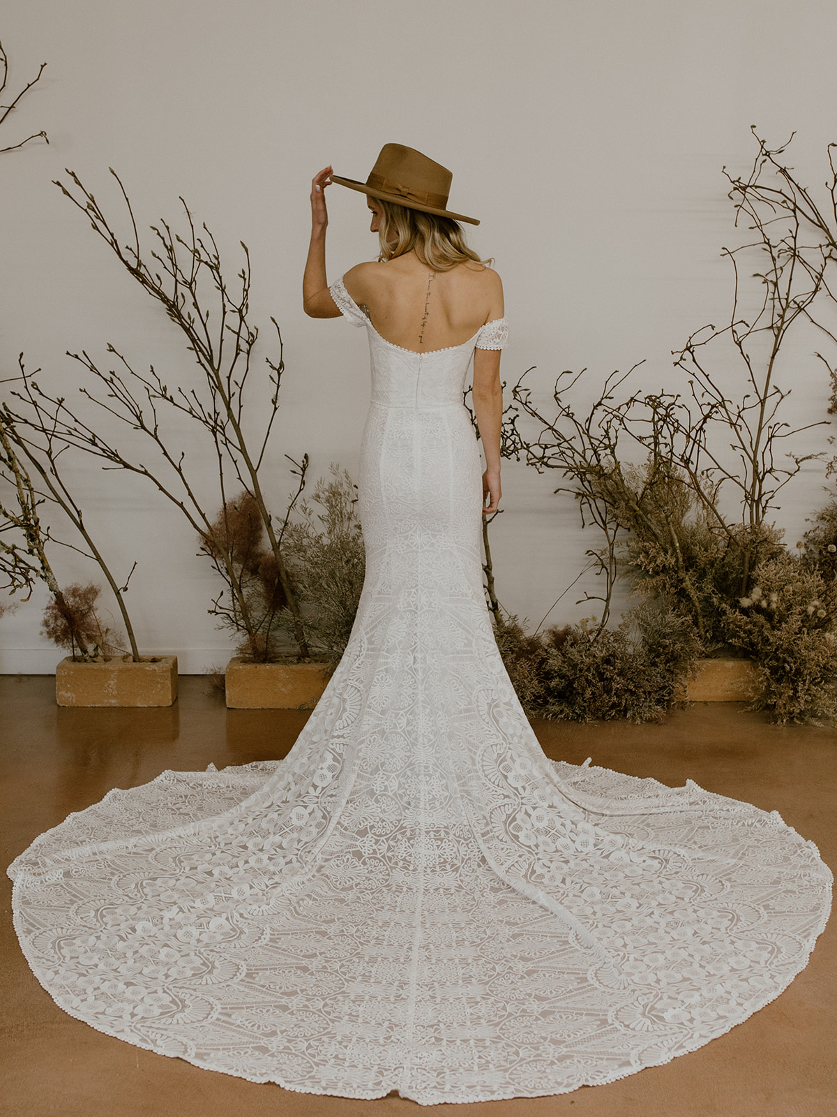 Phoebe-off-the-shoulder-lace-wedding-dress-showin-in-off-white-liner-perfect-for-the-classic-bohemian-bride