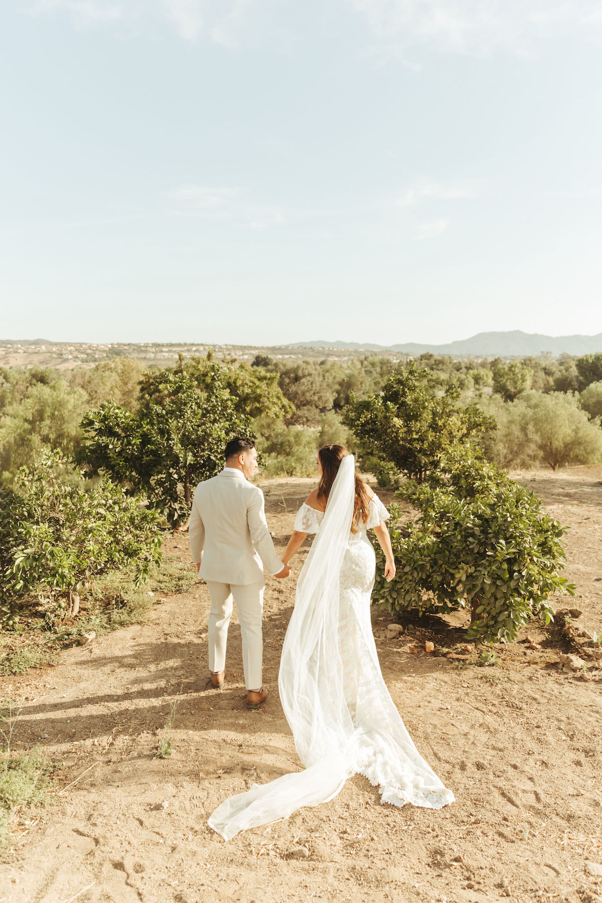 Bride-and-groom-in-the-fields-at-their-country-ranch-wedding