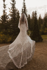 Bride-wearing-non-traditional-colorful-wedding-dress-in-the-mountains-back-view