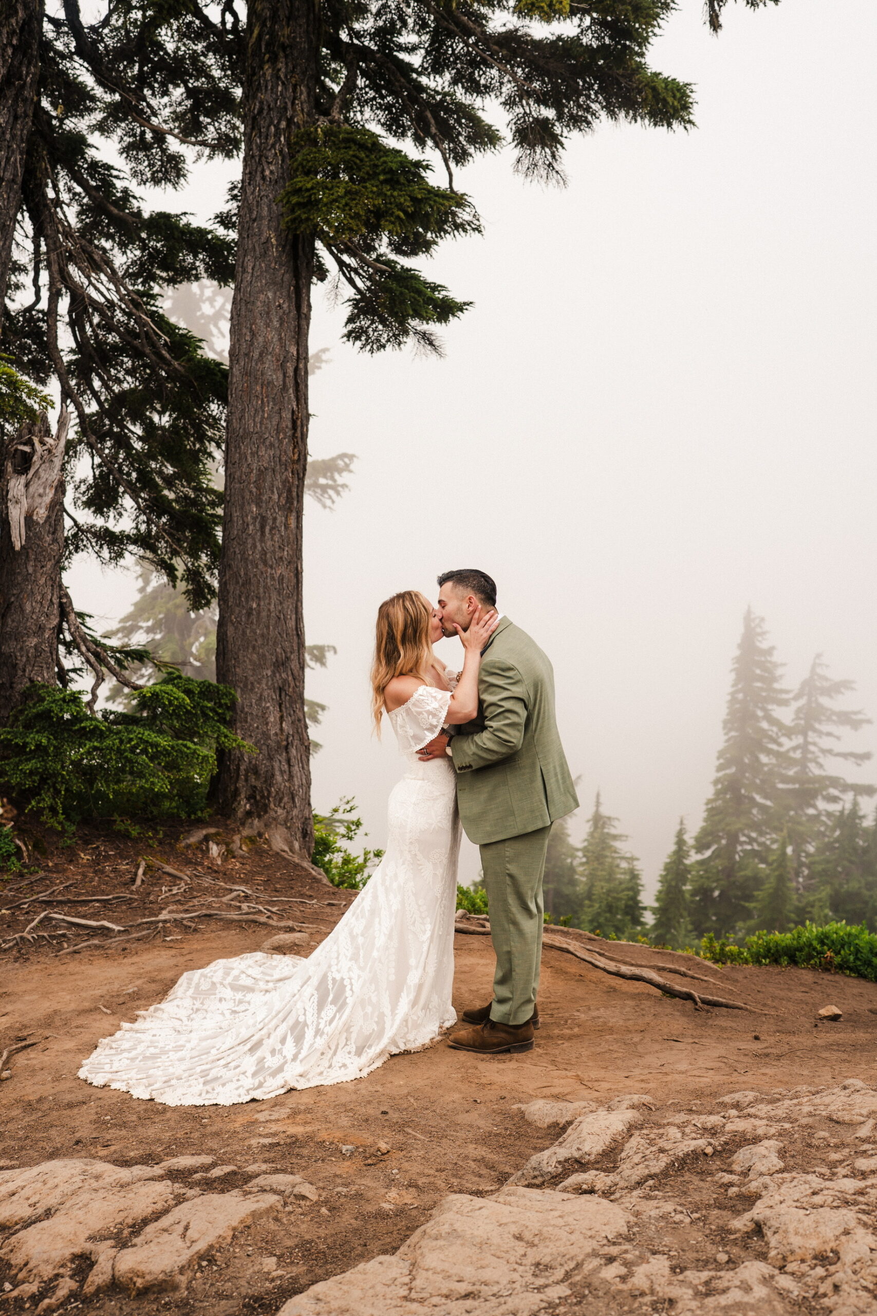 Real bride Amanda wearing the Caroline lace wedding dress in the mountains
