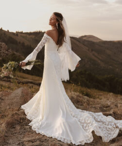 Margot-handcraftes-bell-sleeve-lace-wedding-dress-with-flowy-skirt-and-off-shoulder-neckline