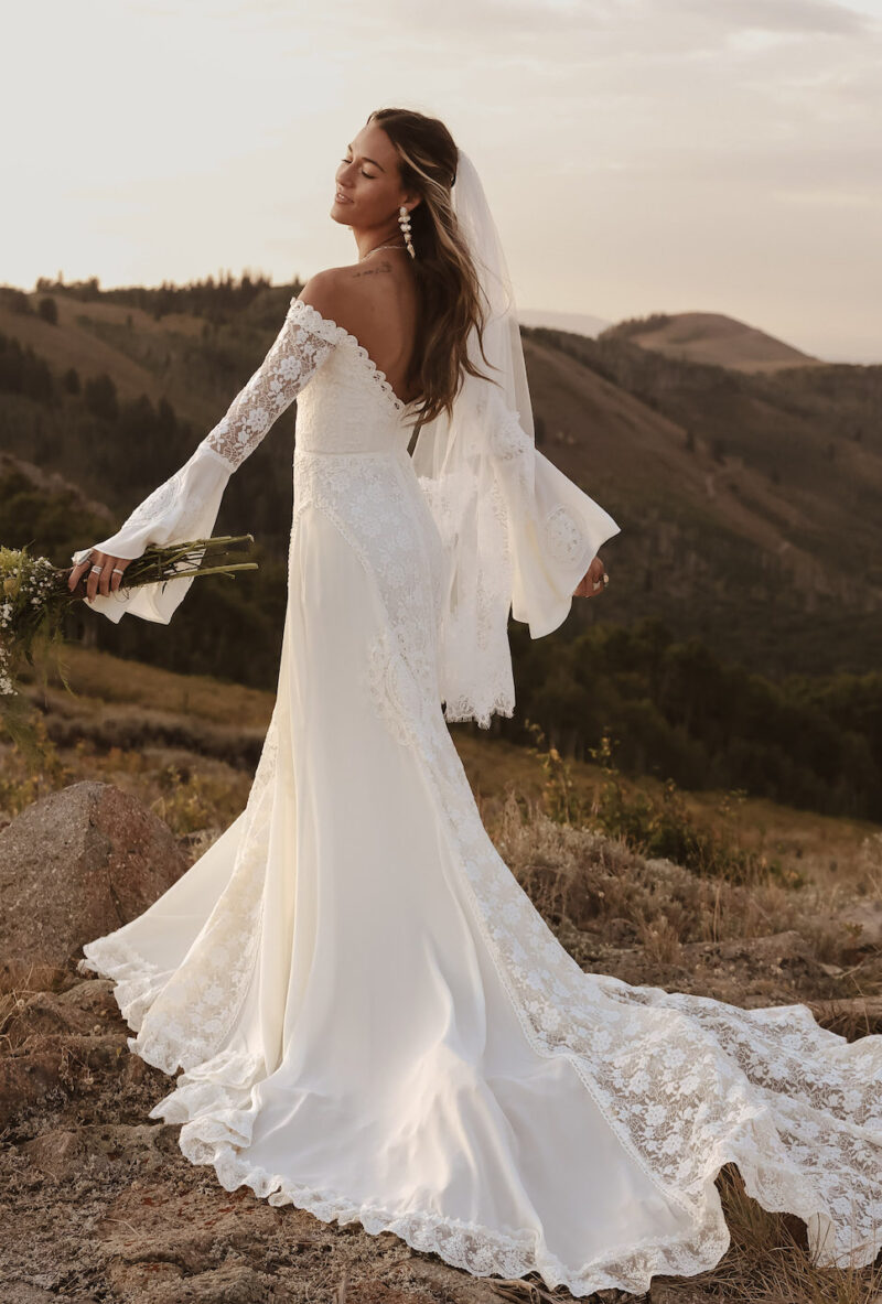 Margot-handcraftes-bell-sleeve-lace-wedding-dress-with-flowy-skirt-and-off-shoulder-neckline
