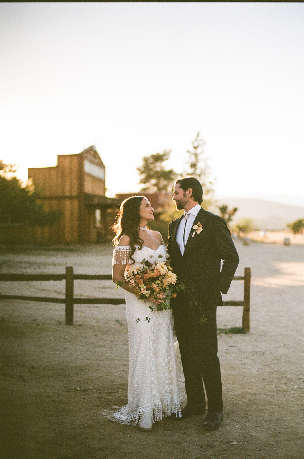 Bride wearing unique lace wedding dress in Palm Springs at her bohemian ceremony
