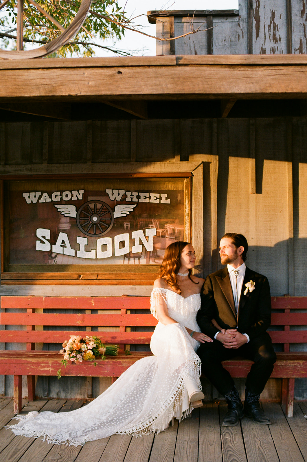 Bride Lucy in the Heather western boho wedding dress with fringe