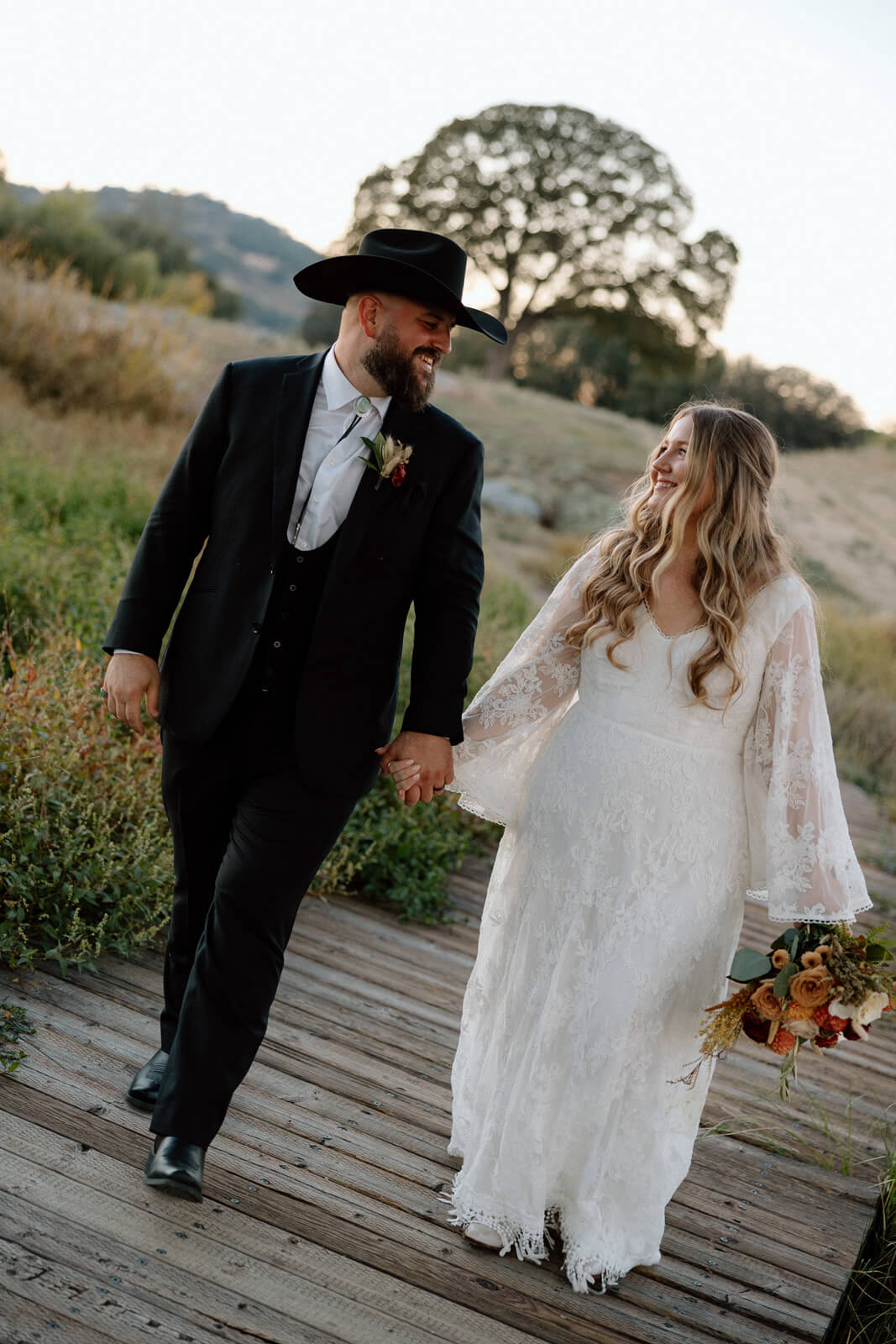 Bride Kristina wearing her custom Carissa ethereal flowy wedding dress with matching veil
