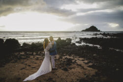 Bride Angie wearing Lizzy bride-angie-elopement-photo-wearing-an-off-shoulder-stretch-lace-bohemian-gown