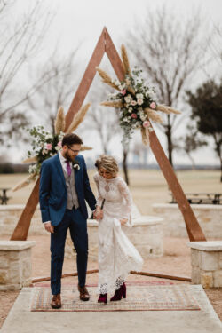Bride Angela wearing Aurora Gown | Photo: @outlandweddings Bride-Angie-wearing-Aurora-wedding-dress-with-velvet-booties