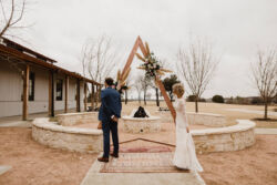 Bride Angela wearing Aurora Gown | Photo: @outlandweddings Bohemian-bride-Angie-wearing-Aurora-wedding-dress-getting-ready-for-her-first-look