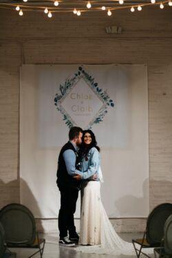 Chloe wearing Florence Gown | Photo: Swatch Studios hipster-bride-and-groom-Chloe-waers-dotted-lace-backless-gown-with-floral-applique