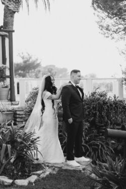Real Bride wearing an off the shoulder wedding dress in the most beautiful lace
