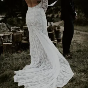 Real Bride wearing a Lace Backless Long Sleeve Lace Wedding Dress | Book your boho wedding dress appointment